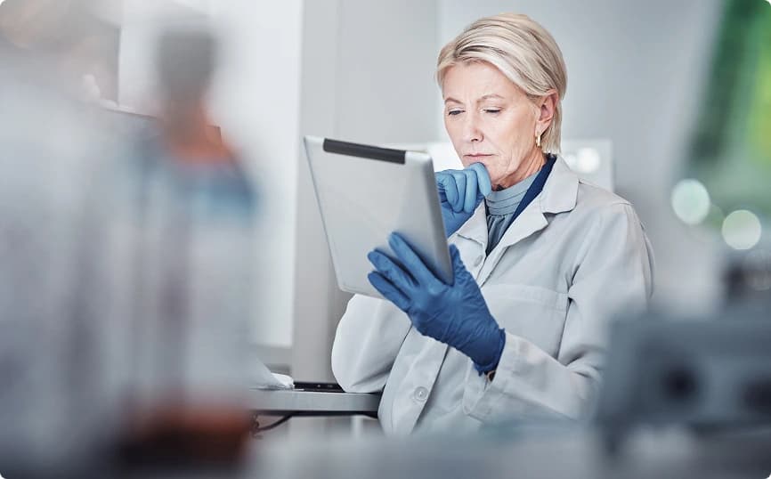 Lab professional with tablet in laboratory